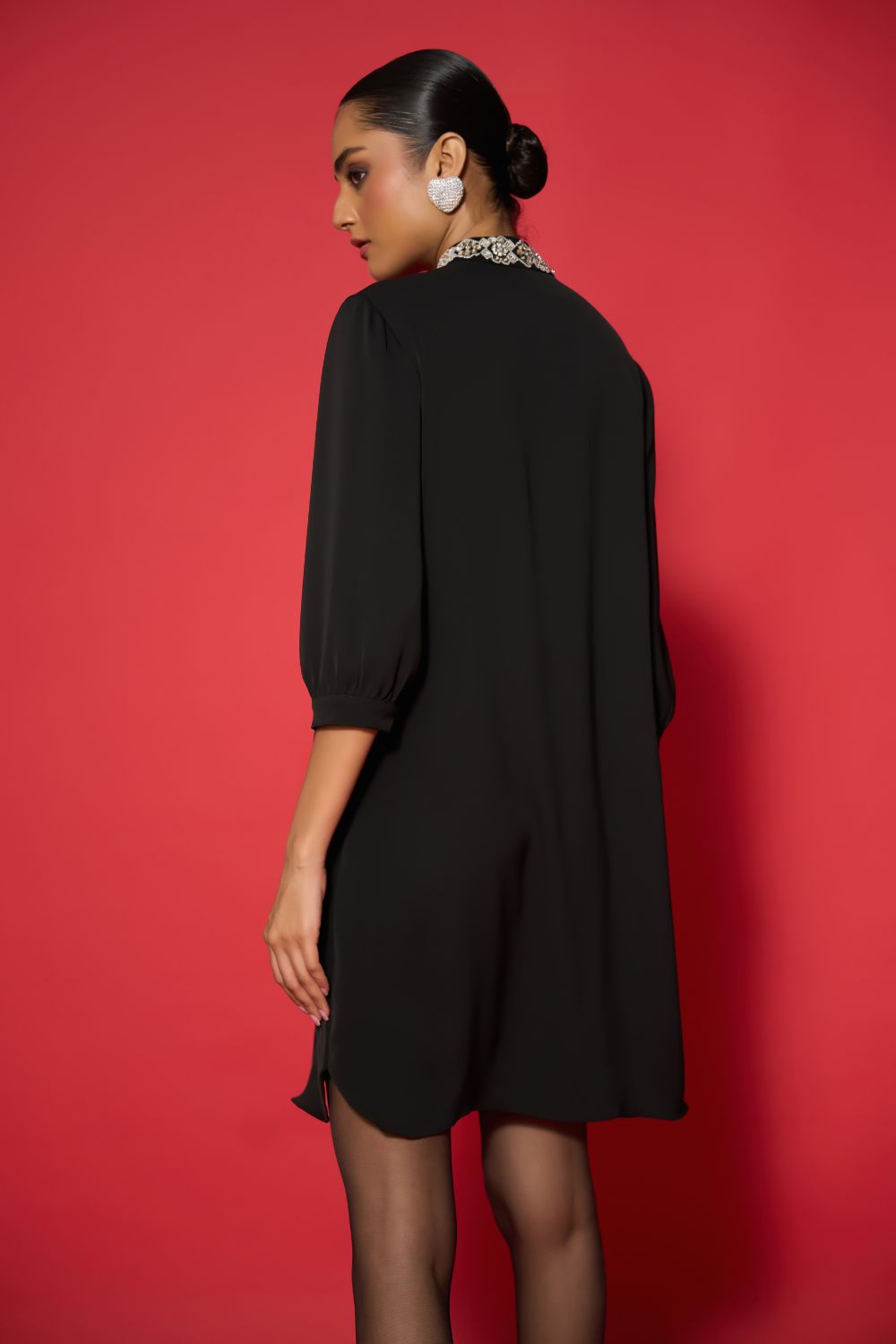 Back view of Lexi Embroidered Dress women's embroidered dress featuring intricate decorative detailing and a statement silhouette, styled for festive gatherings, evening celebrations, resort dinners and special occasions.