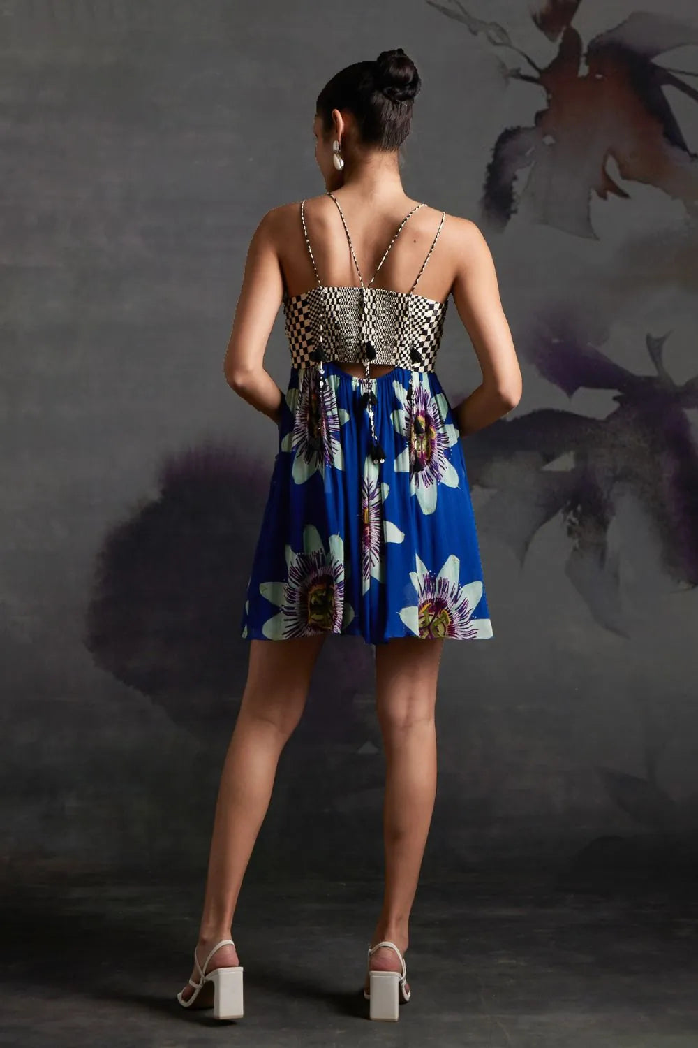 Back view of Lilly Mini Dress in Prussian Blue women's mini dress featuring a stylish feminine silhouette and statement design, styled for summer holidays, brunch outings, resort getaways and daytime celebrations.
