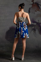 Back view of Lilly Mini Dress in Prussian Blue women's mini dress featuring a stylish feminine silhouette and statement design, styled for summer holidays, brunch outings, resort getaways and daytime celebrations.