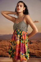 Lilly Mini Dress in Sunny Mustard women's mustard yellow viscose georgette mini dress featuring a vibrant floral print and a playful, lightweight silhouette, styled for summer brunches, vacation outings, garden parties and resort holidays.