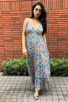 Malini Agarwal wearing the Insia Spaghetti Dress, a women's cobalt blue viscose georgette maxi dress featuring a vibrant multicolour print, delicate spaghetti straps and a flowing 54-inch silhouette, styled for summer holidays, beach getaways, resort evenings and destination celebrations.