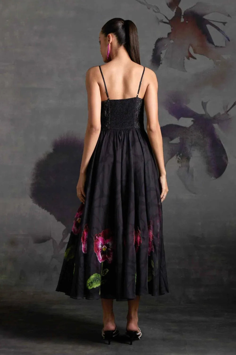 Back view of Marlena Corset Dress women's black organza maxi dress featuring a structured corset bodice, floral print and delicate sequin embellishments, combining a fitted upper silhouette with an elegant floor-length design, styled for cocktail parties, formal celebrations, evening events and special occasions.