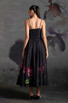 Back view of Marlena Corset Dress women's black organza maxi dress featuring a structured corset bodice, floral print and delicate sequin embellishments, combining a fitted upper silhouette with an elegant floor-length design, styled for cocktail parties, formal celebrations, evening events and special occasions.