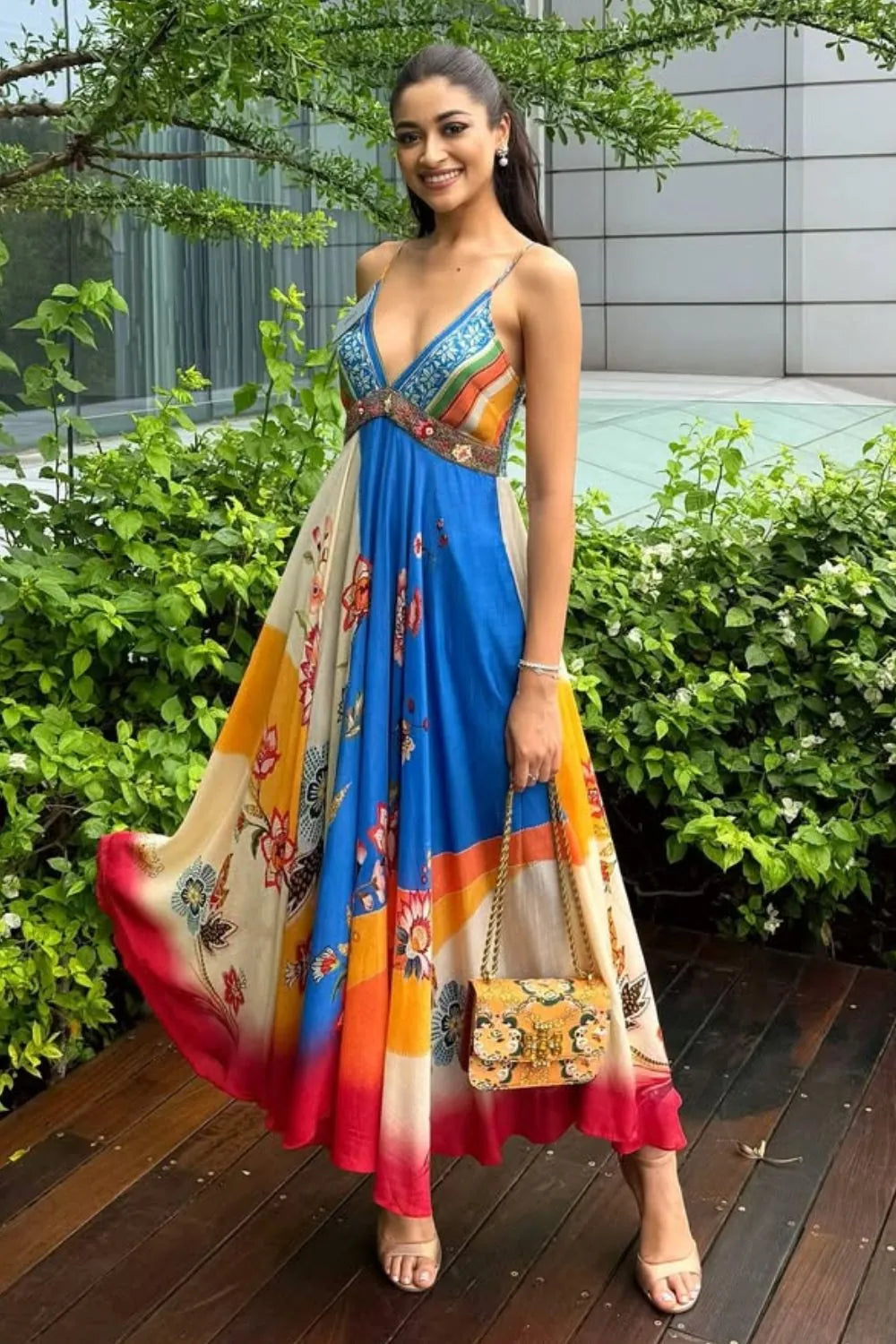 Nandini Gupta wearing the Ayla Dress, a women's multicolour satin maxi dress featuring an engineered floral print, plunging neckline, embroidered beaded neckline and adjustable smocked back, styled for resort vacations, summer holidays and casual day outings.