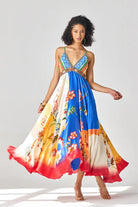 Nandini Gupta wearing the Ayla Dress, a women's multicolour satin maxi dress featuring an engineered floral print, plunging neckline, embroidered beaded neckline and adjustable smocked back, styled for resort vacations, summer holidays and casual day outings.