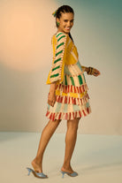 Side view of Nina Dress women's dress featuring an elegant silhouette and refined contemporary design, styled for summer brunches, resort vacations, daytime gatherings and special occasions.