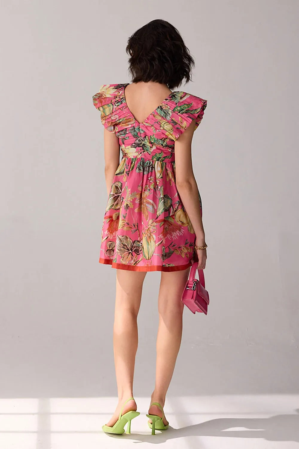 Back view of Nirvi Mini Dress women's mini dress featuring a contemporary silhouette and distinctive design details, styled for summer brunches, resort vacations, holiday outings and casual celebrations.
