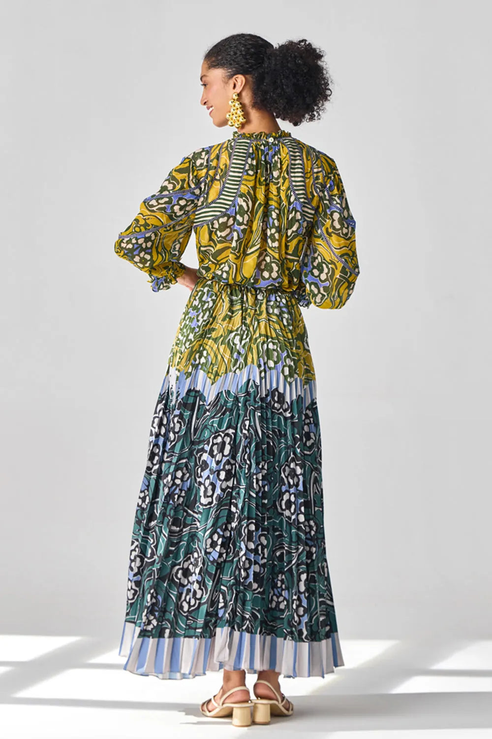 Back view of Nola Blouse women's statement blouse featuring a feminine silhouette and contemporary detailing, designed for effortless styling with skirts or trousers, suited for summer brunches, resort outings, holiday gatherings and casual occasions.