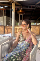 Nriti Shah wearing the Irida Spaghetti Dress, a women's multicolour Viscose Lurex Georgette maxi dress featuring a jacquard printed colour-blocked design, delicate spaghetti straps and shimmering fabric with a flowing silhouette, styled for resort vacations, festive evenings, holiday getaways and special occasions.