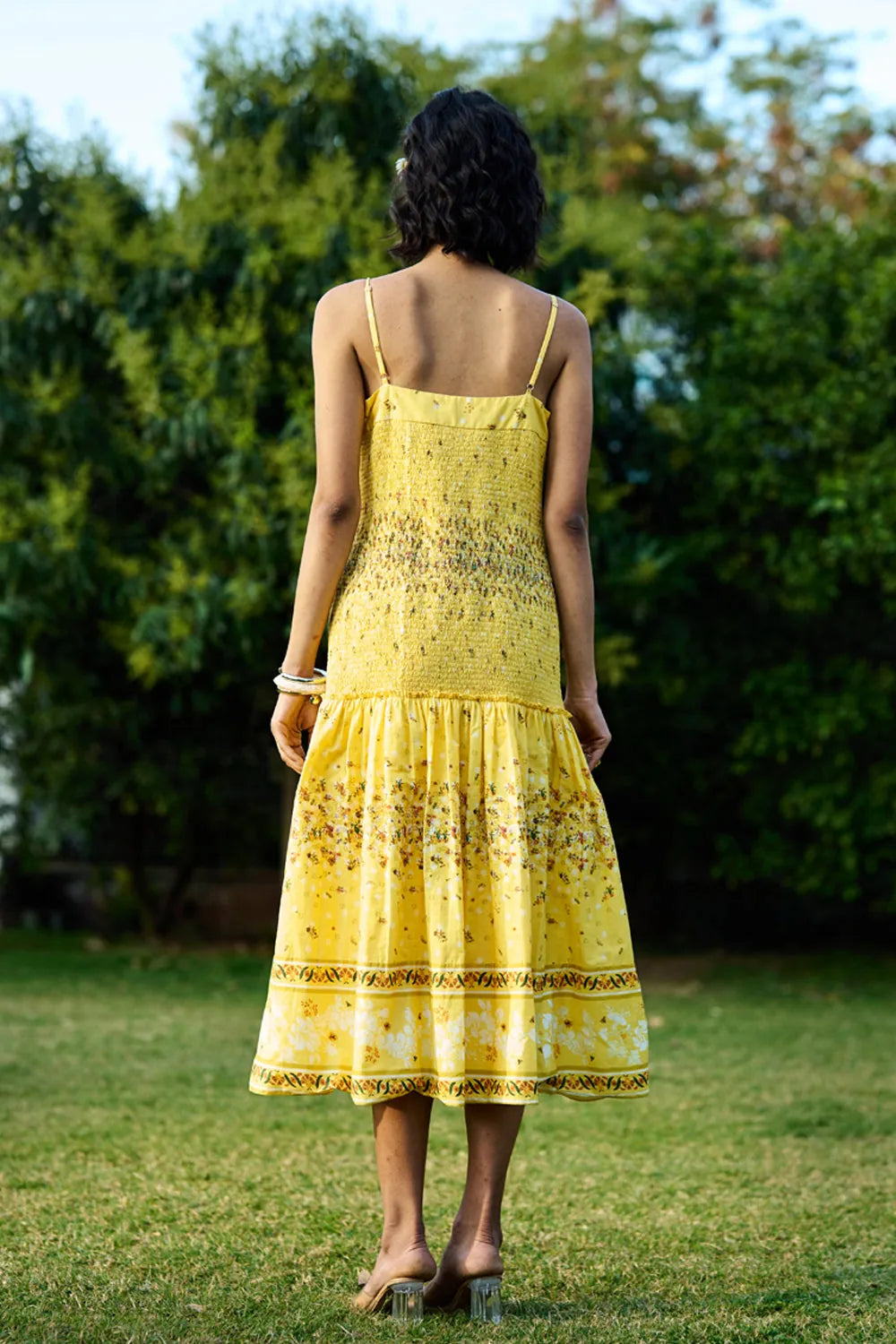 Back View of Ocher Dress women's ochre-toned dress featuring a contemporary silhouette and elegant design details, styled for summer brunches, resort vacations, daytime gatherings and special occasions.