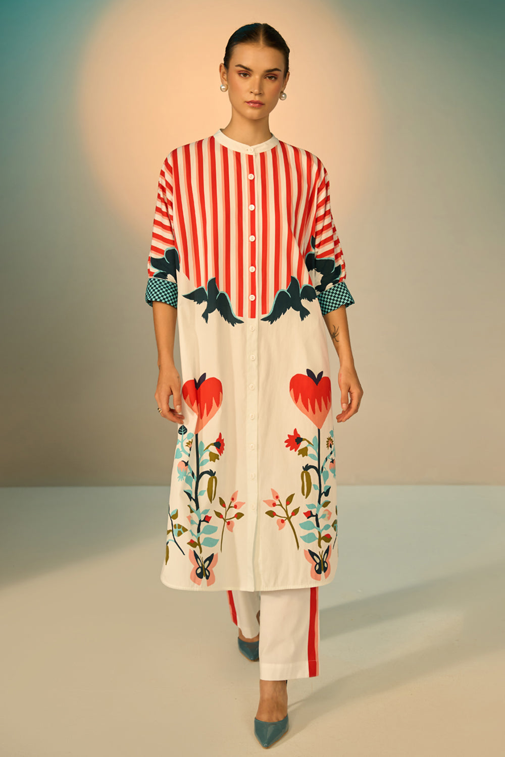 Peta Dress With Pants women's multicolour cotton poplin co-ord set featuring a bold graphic print dress paired with contrasting off-white stretch cotton trousers, combining playful patterns with a relaxed, easy-layering silhouette, styled for beach holidays, festivals, travel days and casual day-to-evening dressing.