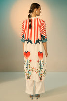 Peta Dress With Pants women's multicolour cotton poplin co-ord set featuring a bold graphic print dress paired with contrasting off-white stretch cotton trousers, combining playful patterns with a relaxed, easy-layering silhouette, styled for beach holidays, festivals, travel days and casual day-to-evening dressing.