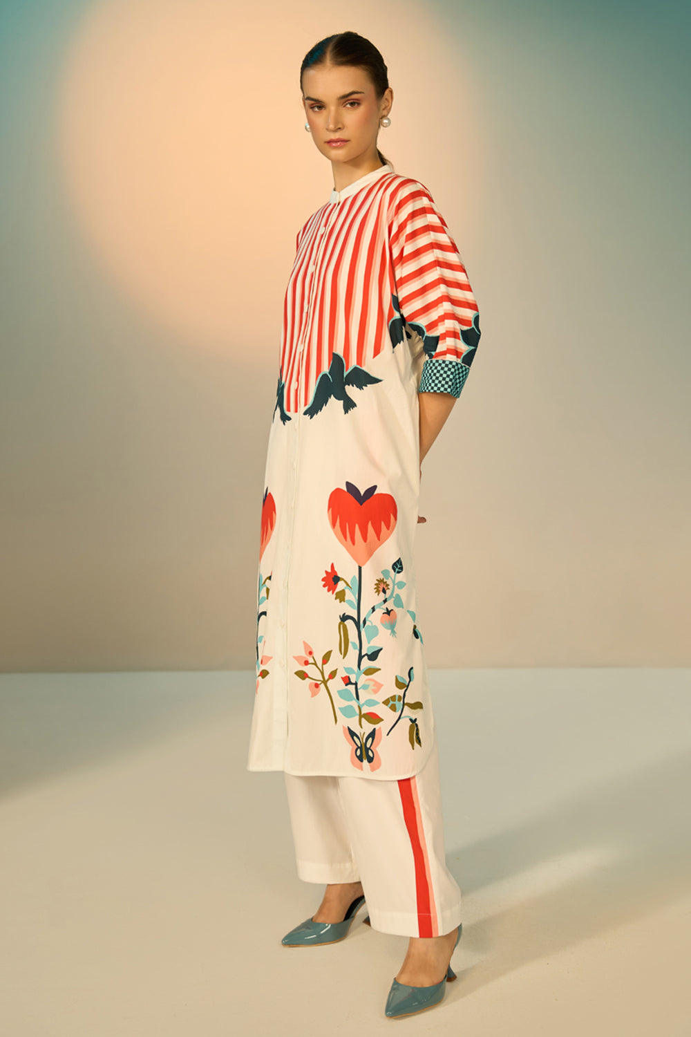 Peta Dress With Pants women's multicolour cotton poplin co-ord set featuring a bold graphic print dress paired with contrasting off-white stretch cotton trousers, combining playful patterns with a relaxed, easy-layering silhouette, styled for beach holidays, festivals, travel days and casual day-to-evening dressing.