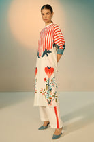 Peta Dress With Pants women's multicolour cotton poplin co-ord set featuring a bold graphic print dress paired with contrasting off-white stretch cotton trousers, combining playful patterns with a relaxed, easy-layering silhouette, styled for beach holidays, festivals, travel days and casual day-to-evening dressing.