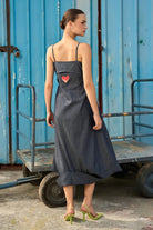 Back view of Posy Embroidered Dress women's embroidered dress featuring intricate decorative craftsmanship and an elegant silhouette, styled for summer celebrations, resort gatherings, festive daytime events and special occasions.