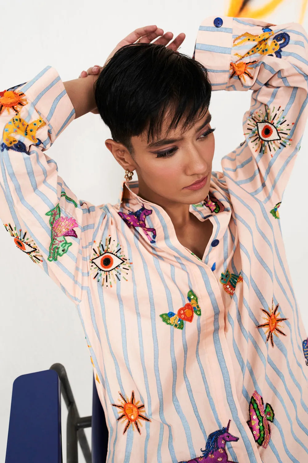Closeup view of Raeya Shirt women's statement shirt featuring a contemporary silhouette and distinctive design details, styled for summer outings, resort vacations, casual brunches and elevated everyday wear.