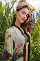 Rawan Bin Hussain wearing the Jianna Dress, a women's multicolour double georgette maxi dress featuring a vibrant mixed print, dramatic flared sleeves and a flowing floor-length silhouette, styled for resort vacations, summer celebrations, destination dinners and elegant daytime occasions.