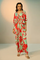 Red Lotus Kaftan women's kaftan featuring a flowing, relaxed silhouette and statement lotus-inspired design, styled for beach holidays, resort vacations, poolside lounging and elegant summer getaways.