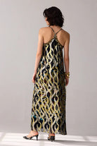 Back view of Romi Embroidered Lurex Dress women's statement dress featuring shimmering Lurex fabric, intricate embroidered detailing and an elegant flowing silhouette, styled for festive celebrations, resort evenings, cocktail gatherings and special occasions.