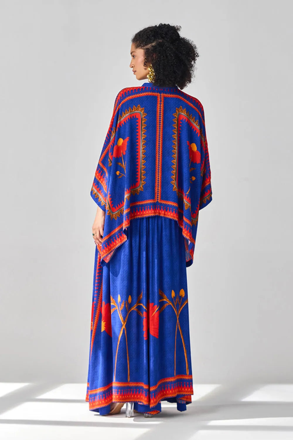 Back view of Romina Cape Pants women's co-ord set featuring a flowing cape-style top paired with matching pants, combining an elegant silhouette with contemporary styling, suited for resort vacations, summer celebrations, festive gatherings and special occasions.