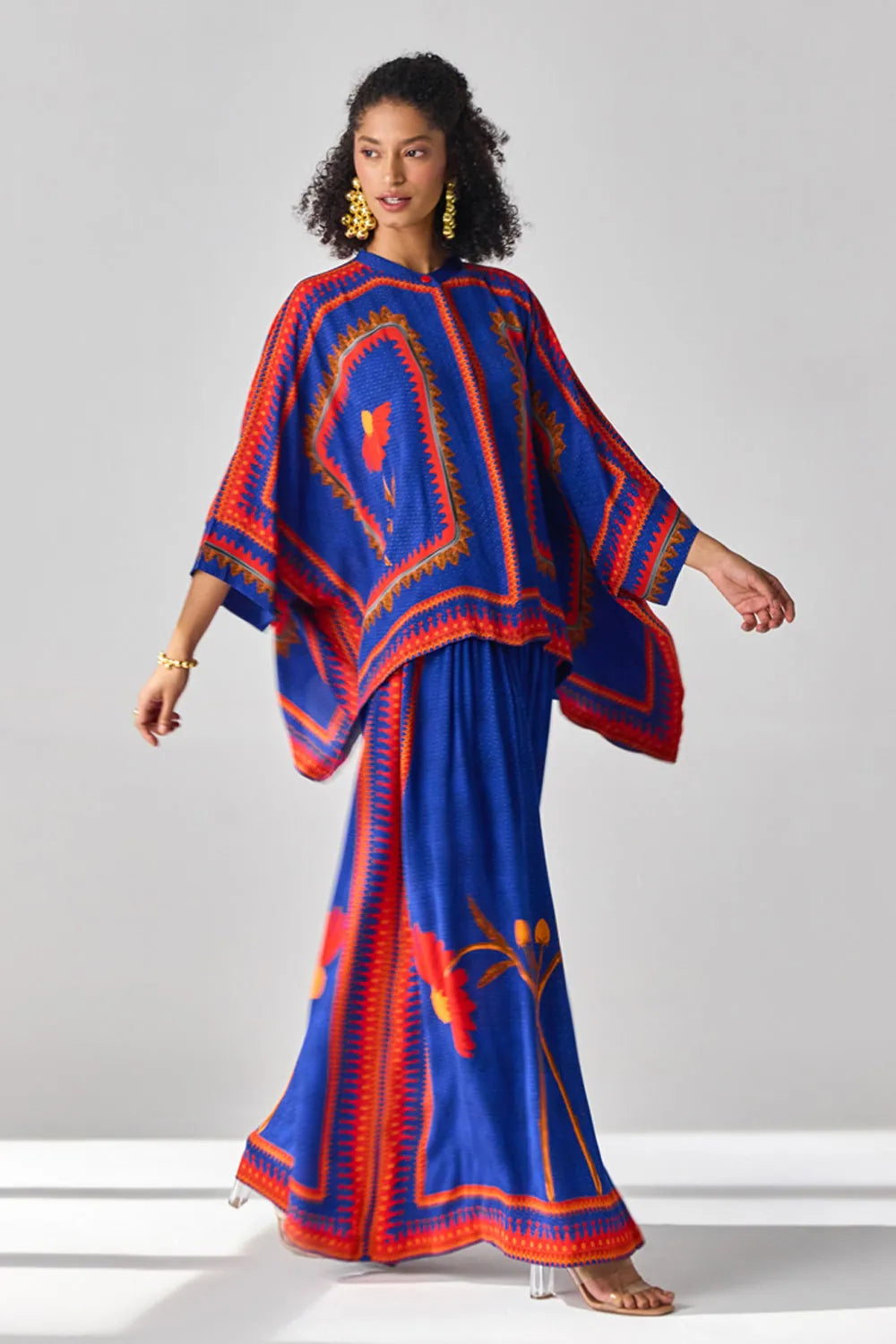 Romina Cape Pants women's co-ord set featuring a flowing cape-style top paired with matching pants, combining an elegant silhouette with contemporary styling, suited for resort vacations, summer celebrations, festive gatherings and special occasions.