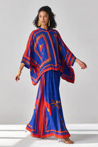 Romina Cape Pants women's co-ord set featuring a flowing cape-style top paired with matching pants, combining an elegant silhouette with contemporary styling, suited for resort vacations, summer celebrations, festive gatherings and special occasions.