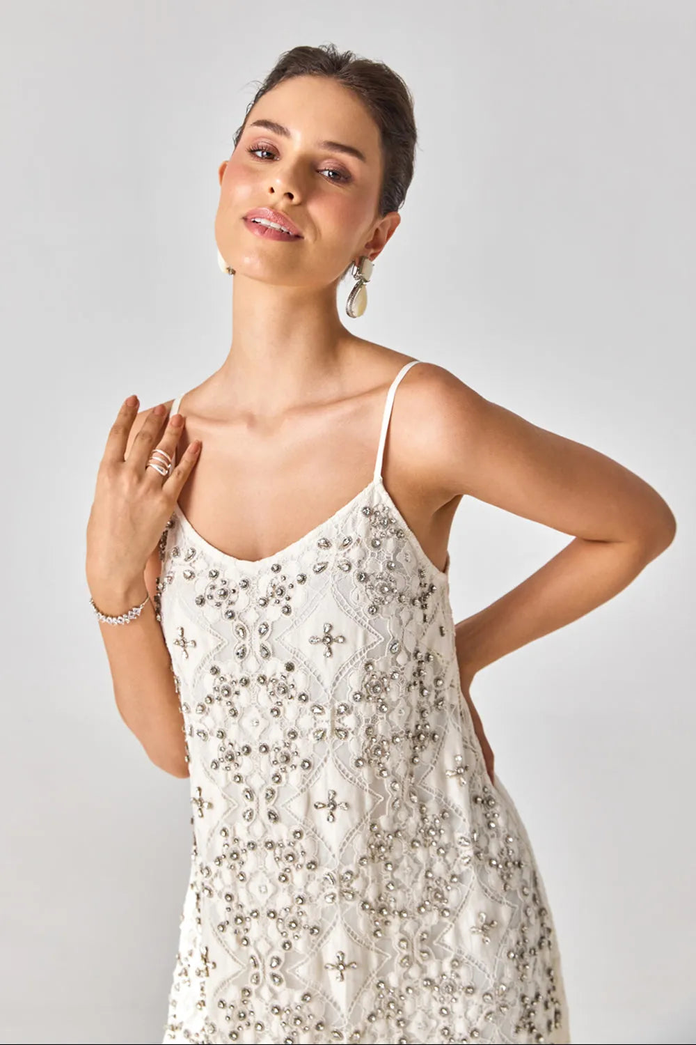Closeup look of Rosa Anglasia Studded Dress women's statement dress featuring intricate studded embellishments and a feminine silhouette, designed to create an eye-catching look for festive celebrations, resort evenings, cocktail gatherings and special occasions.