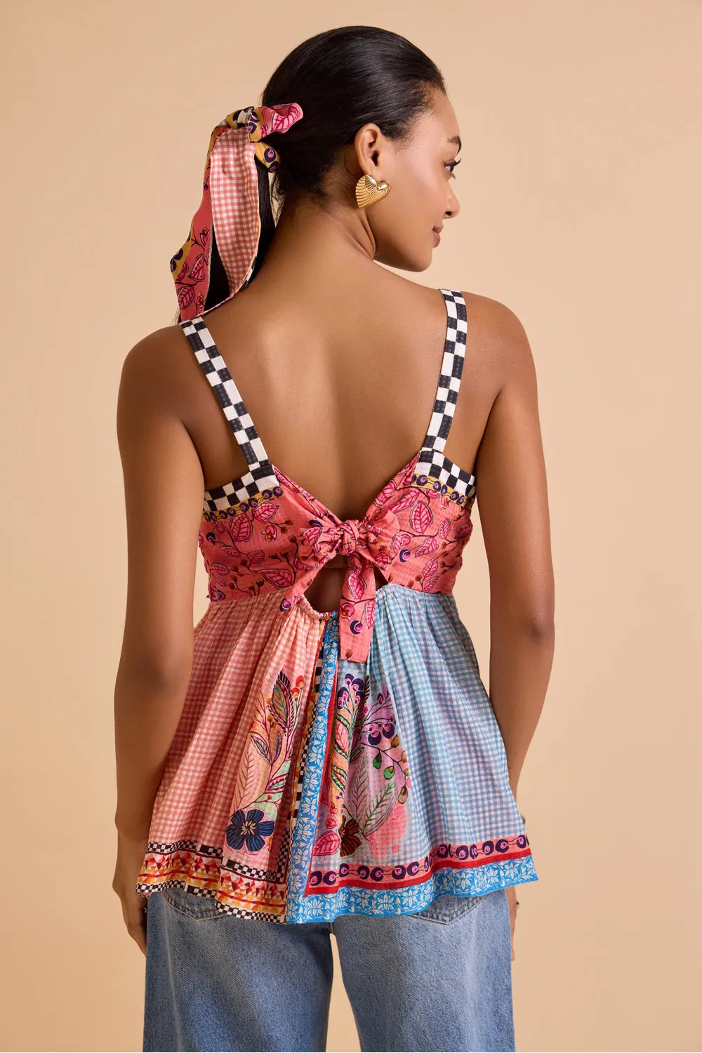 Back view of Sakura Embroidered Blouse women's statement blouse featuring delicate floral embroidery and a contemporary silhouette, designed to pair effortlessly with skirts, trousers or denim, styled for summer brunches, casual outings, resort holidays and elevated everyday wear.