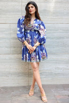 Sanjana Sanghi wearing the Amara Mini Dress, a women's cobalt blue cotton satin mini dress featuring a vibrant printed design and a relaxed swing silhouette, styled for summer outings, brunches, resort vacations and casual celebrations.