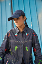 A woman wearing Soha Shirt, a women's coordinated outfit featuring a statement shirt with a relaxed, contemporary silhouette, styled for summer outings, resort vacations, brunches and elevated casual occasions.