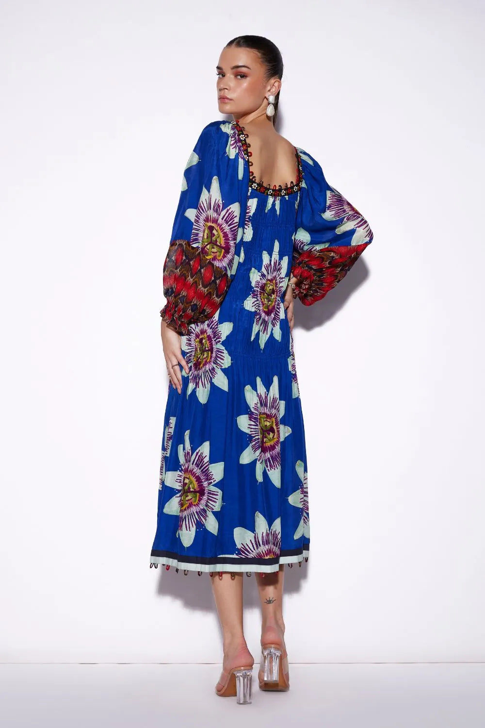 Back view of Tatiana Tier Maxi Dress, a women's maxi dress featuring a flowing tiered silhouette and statement printed design, styled for resort vacations, summer holidays, destination celebrations and elegant daytime occasions.