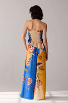 Back view of Tiana Pants women's statement trousers featuring a contemporary silhouette and relaxed fit, designed to pair with the matching Rey Blouse for a coordinated look, styled for summer outings, resort vacations, brunches and elevated casual occasions.