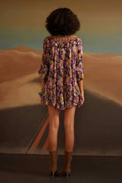 Back view of Trisha Swing Mini Dress women's mini dress featuring a relaxed swing silhouette, playful flared hem and contemporary design, styled for summer brunches, holiday outings, resort vacations and casual daytime celebrations.