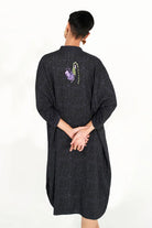 Back view of Tushita Dress women's statement dress featuring a feminine silhouette and distinctive contemporary detailing, styled for summer celebrations, resort vacations, brunches and special occasions.