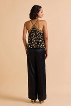 Back view of Xena Beaded Blouse women's statement blouse featuring intricate bead embellishments and a contemporary silhouette, designed to add texture and detail to coordinated outfits, styled for festive gatherings, resort evenings, cocktail events and special occasions.