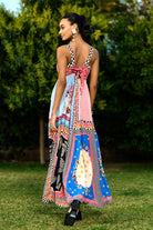 Back view of Aarna Beaded Spaghetti Women's pink printed sleeveless maxi dress with checkerboard trim and vibrant bohemian pattern, styled for resort vacations, summer holidays and brunch outings.