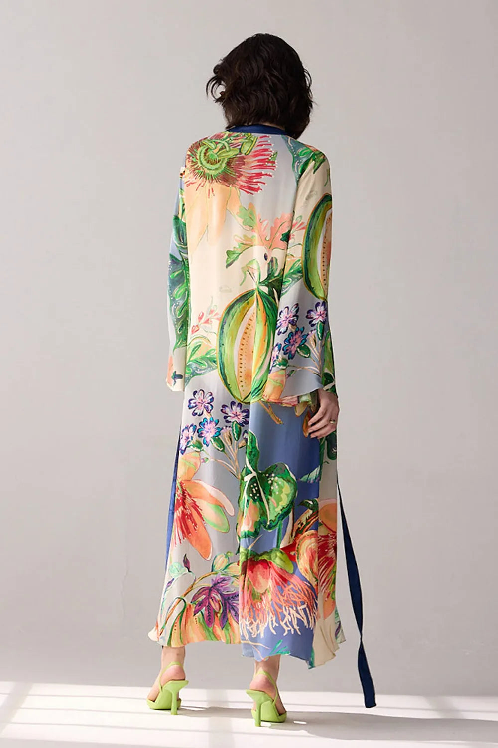 Back view of Alani a blue ombre Dress with double georgette maxi and flare sleeves, and silhouette, perfect for day-to-evening styling.