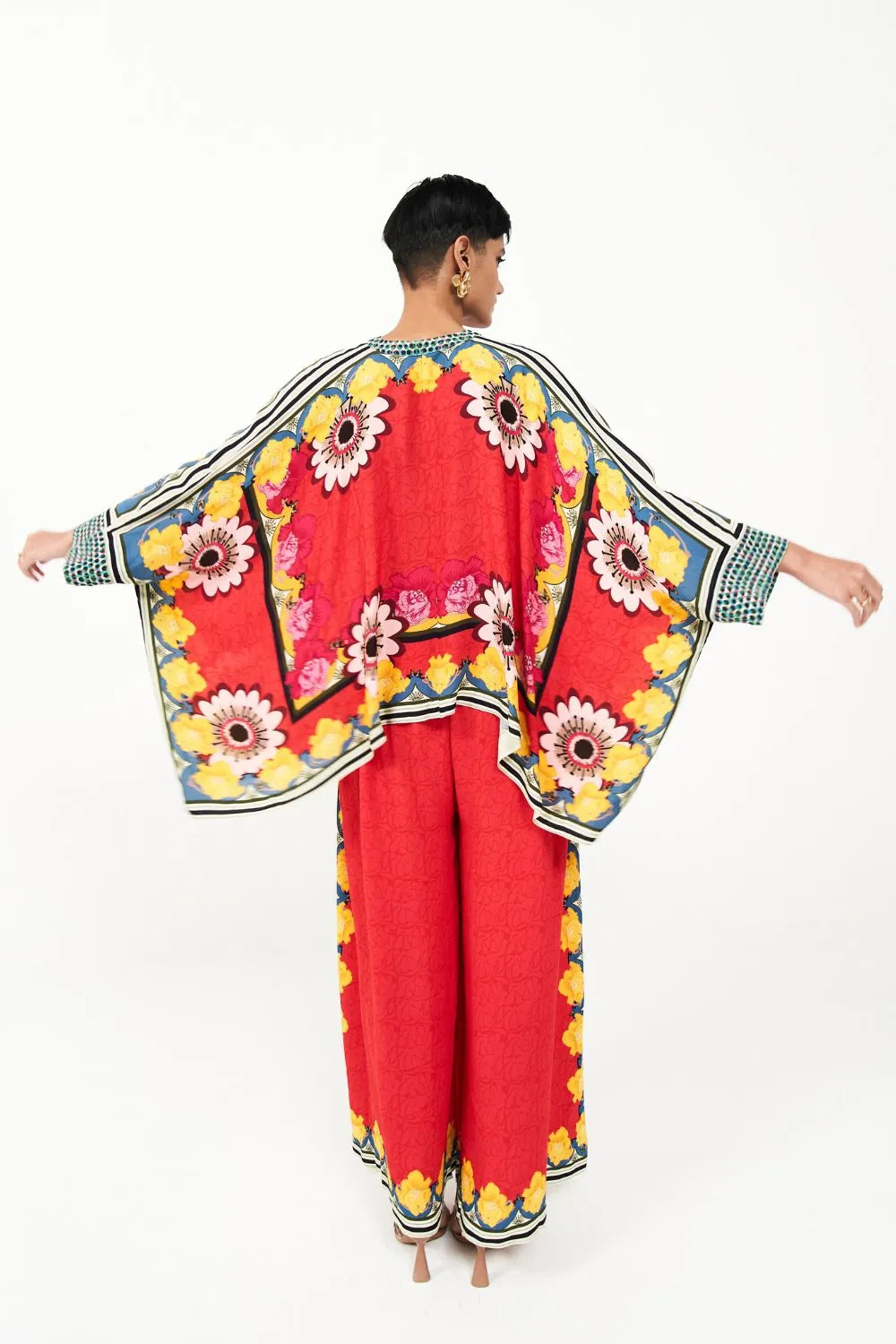 Back view of Alina cape blouse with matching pants