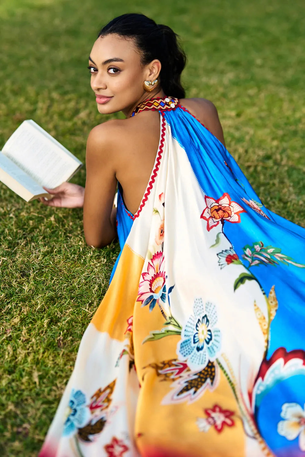 Back view of Arlo multicolour printed midi dress showing the halter neckline, open back detail and flowing flared skirt