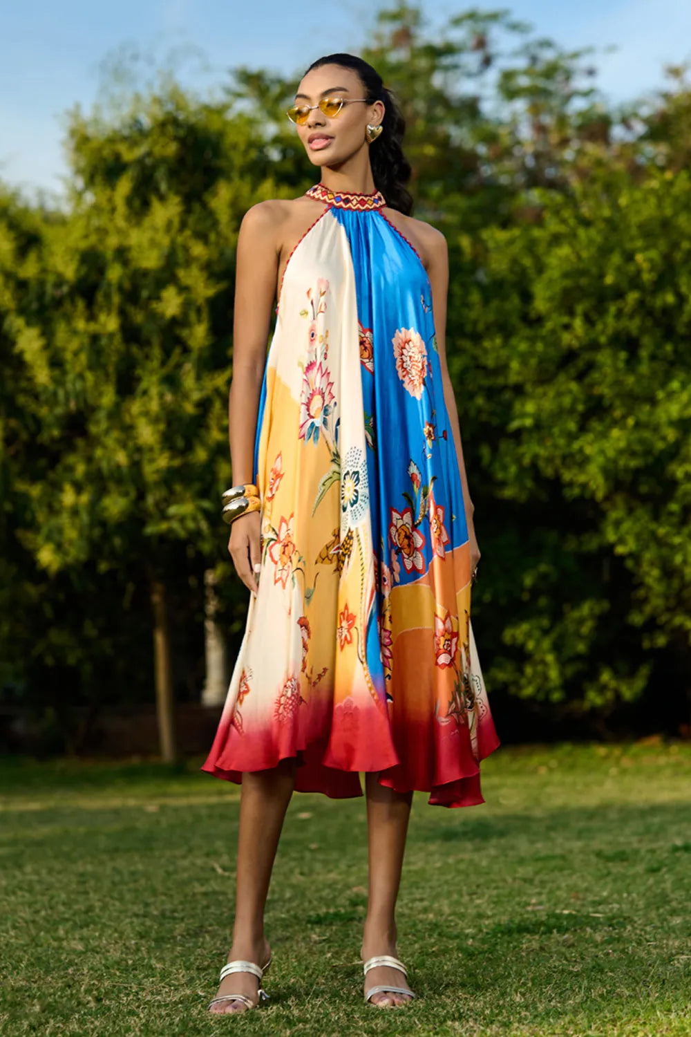 Arlo printed midi dress featuring a vibrant multicolour floral and botanical pattern, sleeveless halter-style neckline, fitted waist and flowing A-line skirt