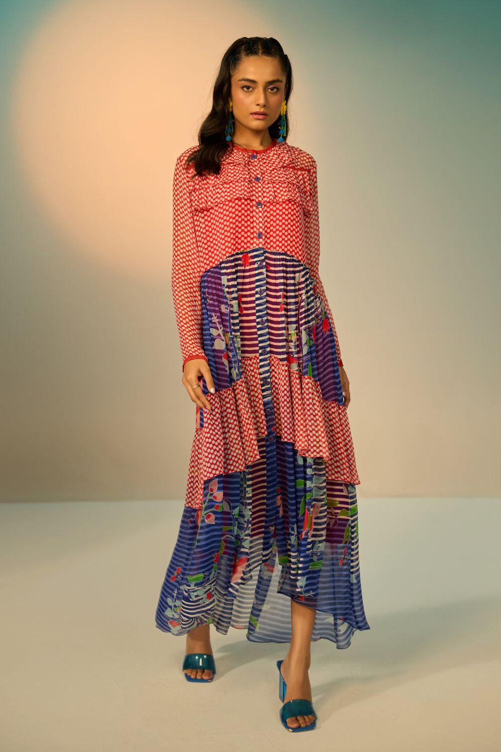 Woman wearing a red and blue striped dress with a clean background