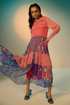 Woman wearing a red and blue striped dress with a clean background